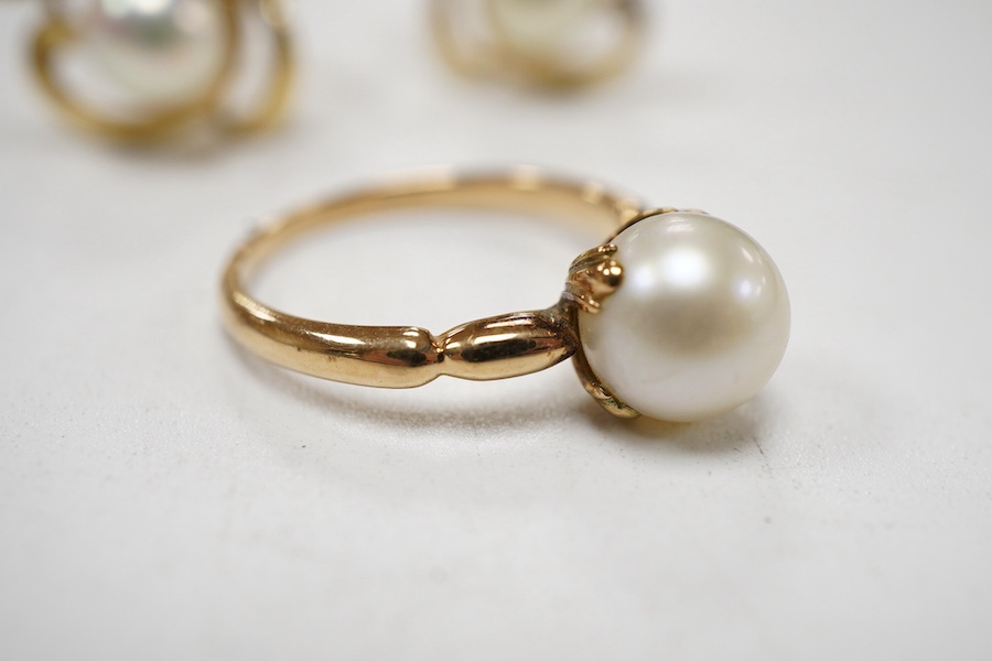 A pair of Mikimoto 14k yellow metal and single stone cultured pearl set ear clips, 17mm, together with a 14k yellow metal and single stone cultured pearl set ring.